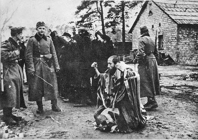 Meir Dagan, who led the Mossad from 2002 to 2011, had this photograph of Nazi soldiers brutalizing his grandfather on the wall of his office.