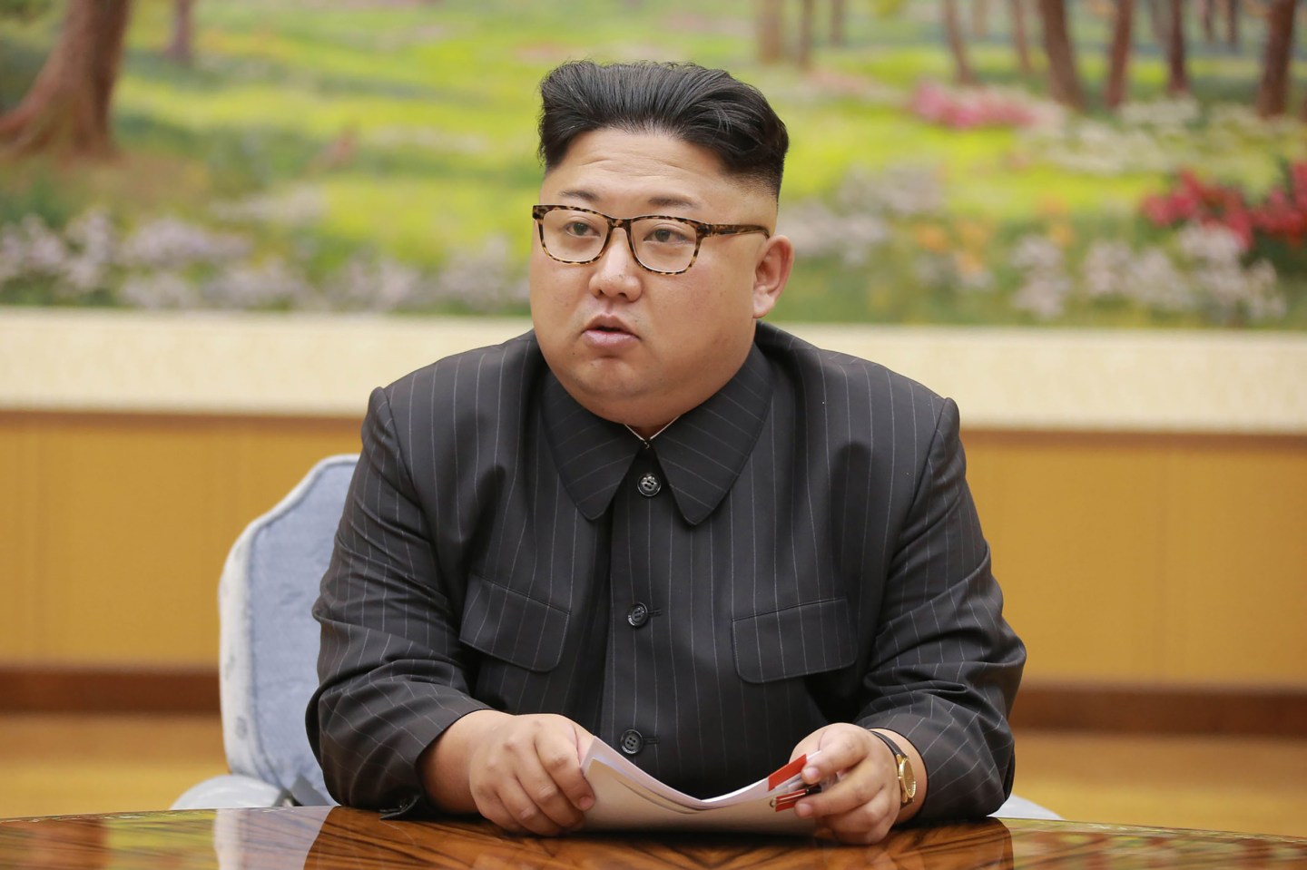 North Korean leader Kim Jong-Un attending a meeting about the test of a hydrogen bomb.